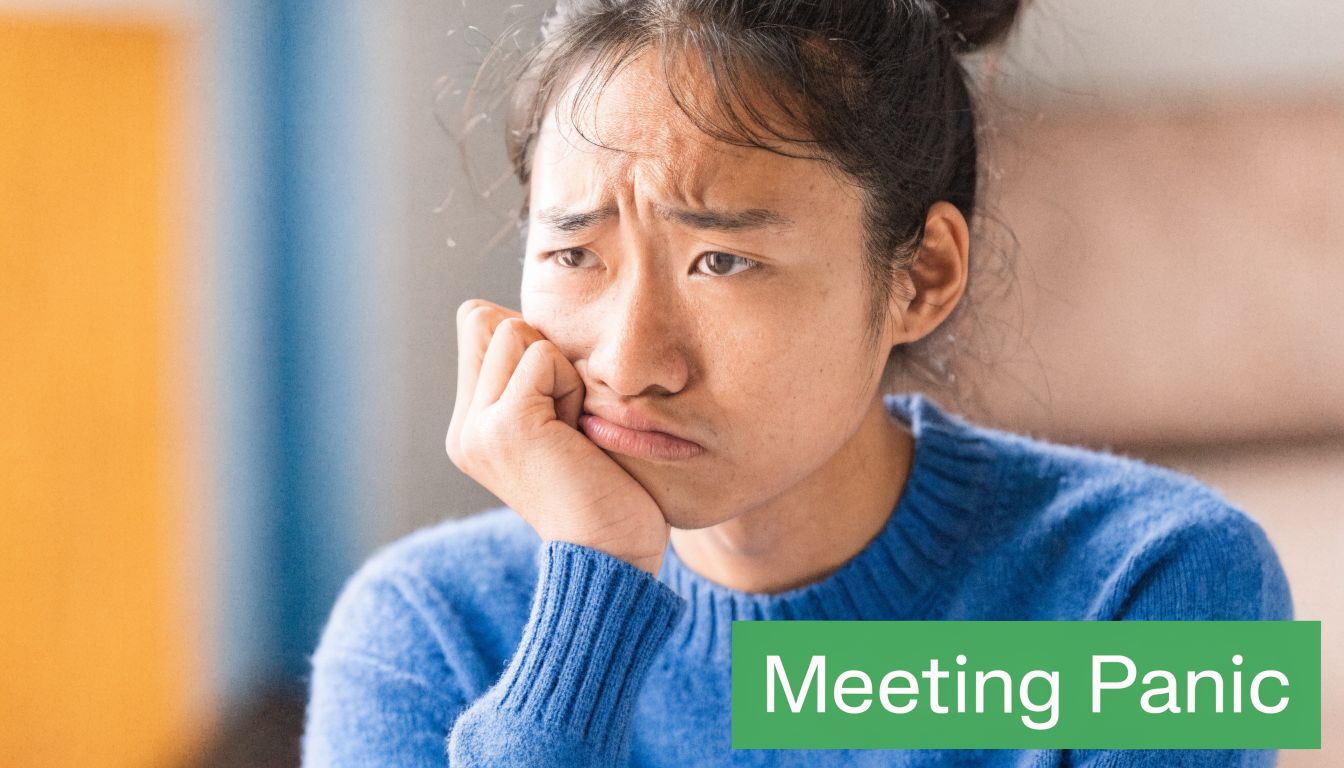 A young woman with a concerned and stressed expression while thinking during a meeting.