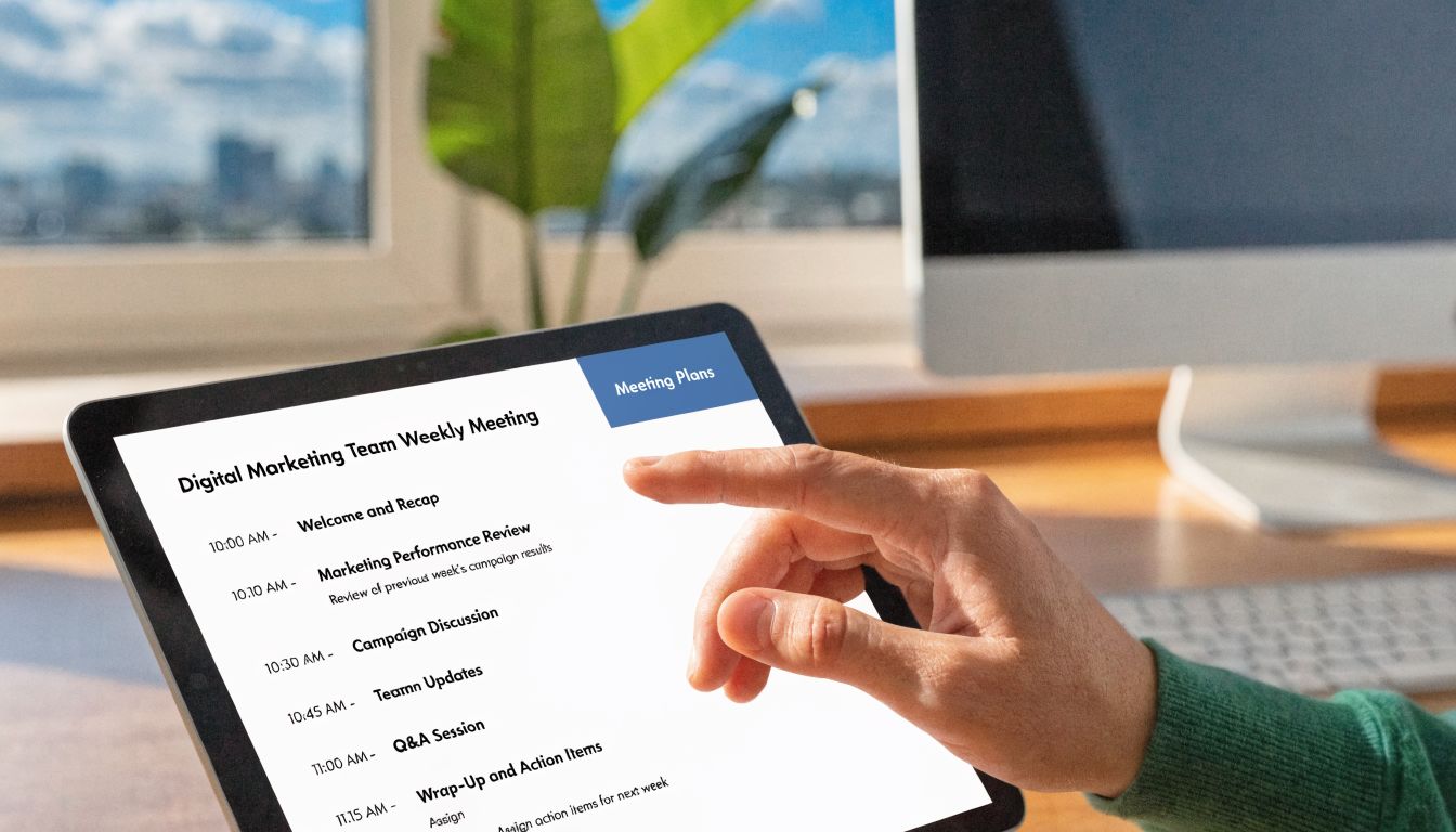 A person holding a digital tablet displaying a weekly digital marketing team meeting agenda.
