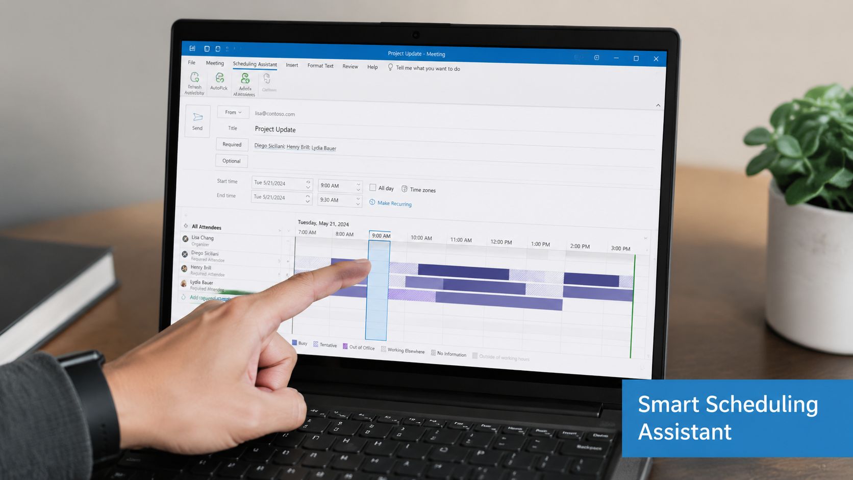 A person using a laptop to schedule a meeting using the Outlook Smart Scheduling Assistant feature.