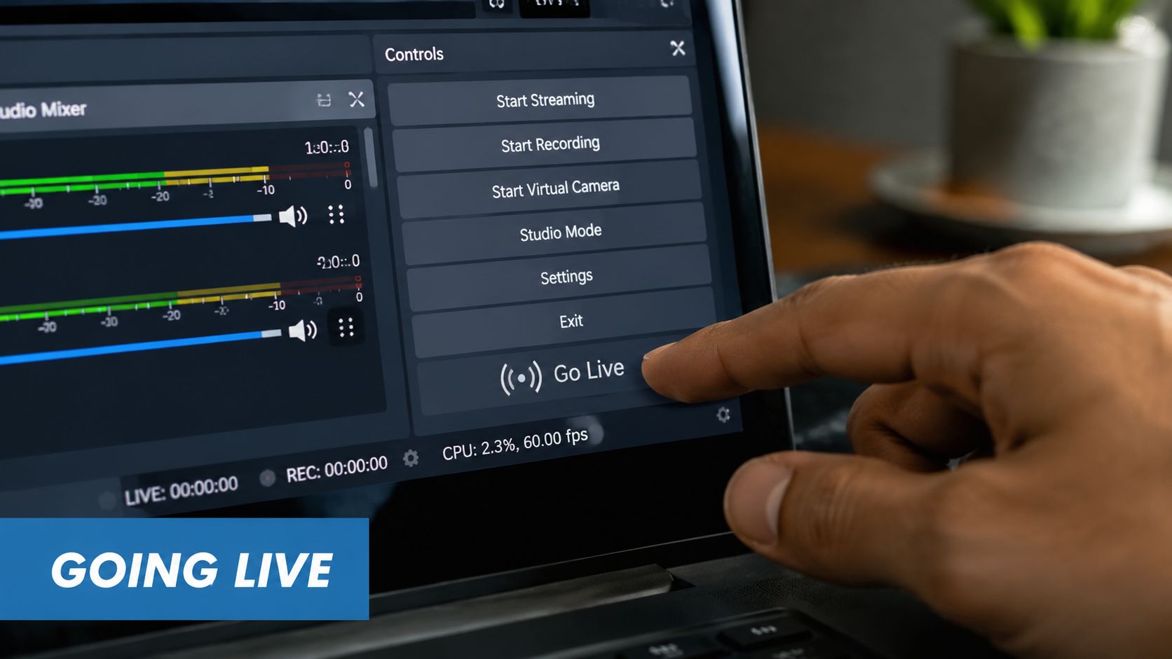 A close-up view of a finger pressing the Go Live button on live streaming software.